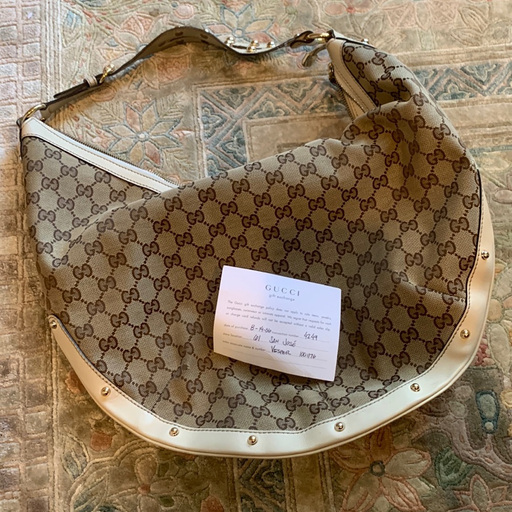 Gucci Hobo in tan cloth & Gucci embossing and cream leather and gold studs.